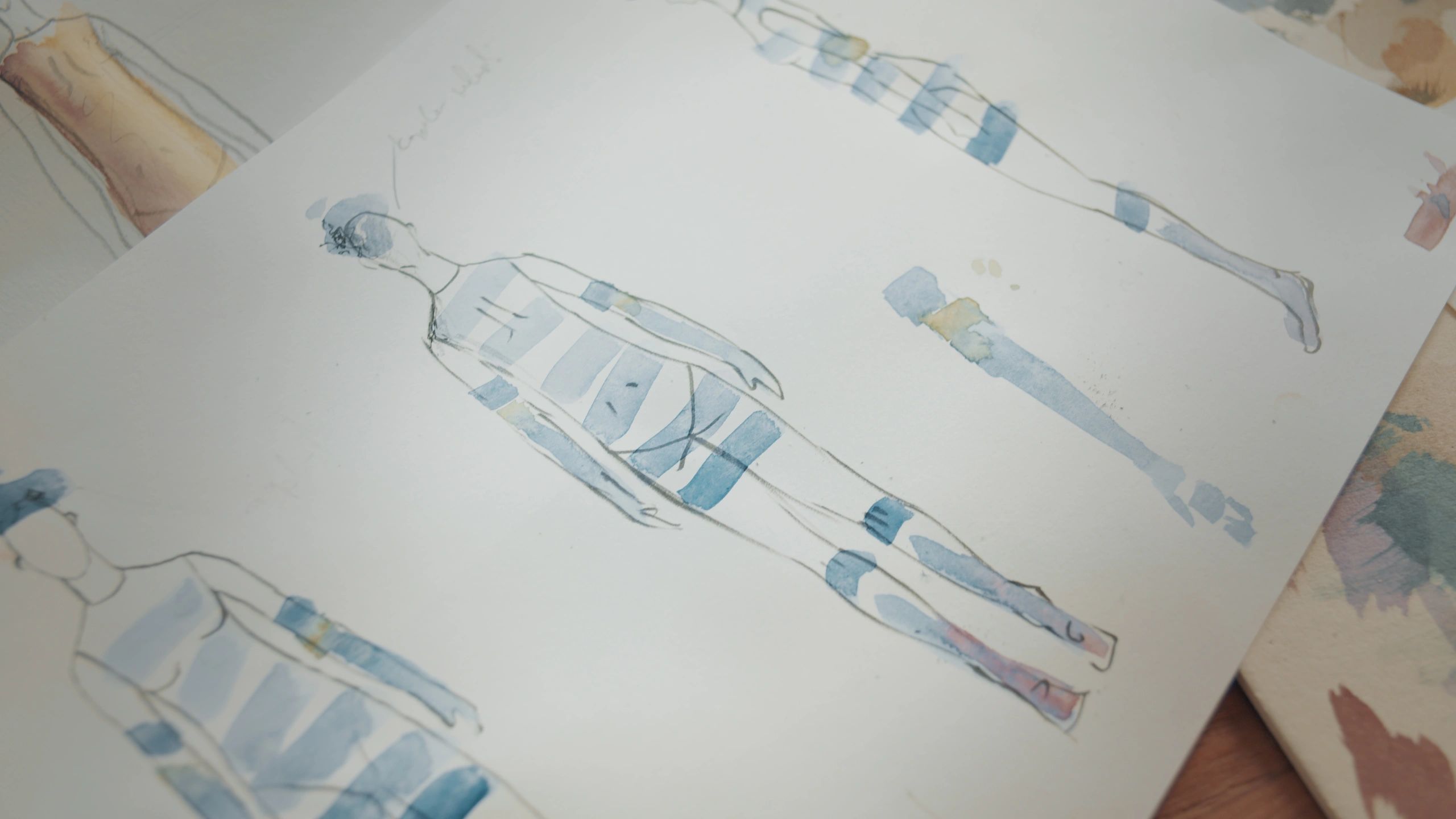 Watercolour painting in progress on a studio table