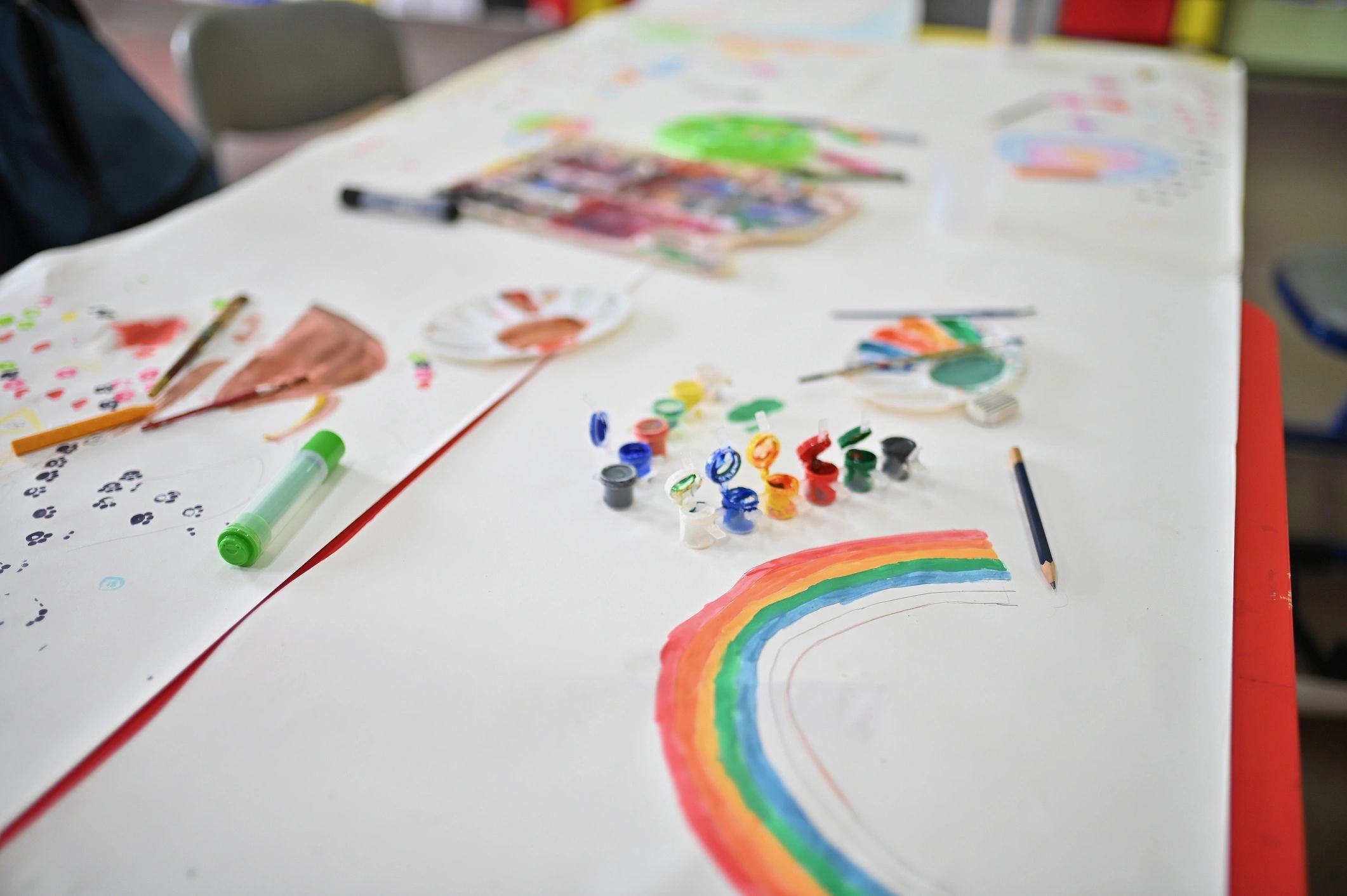 Watercolour pencils and art tools on a table